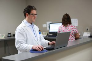 Doctor using a laptop
